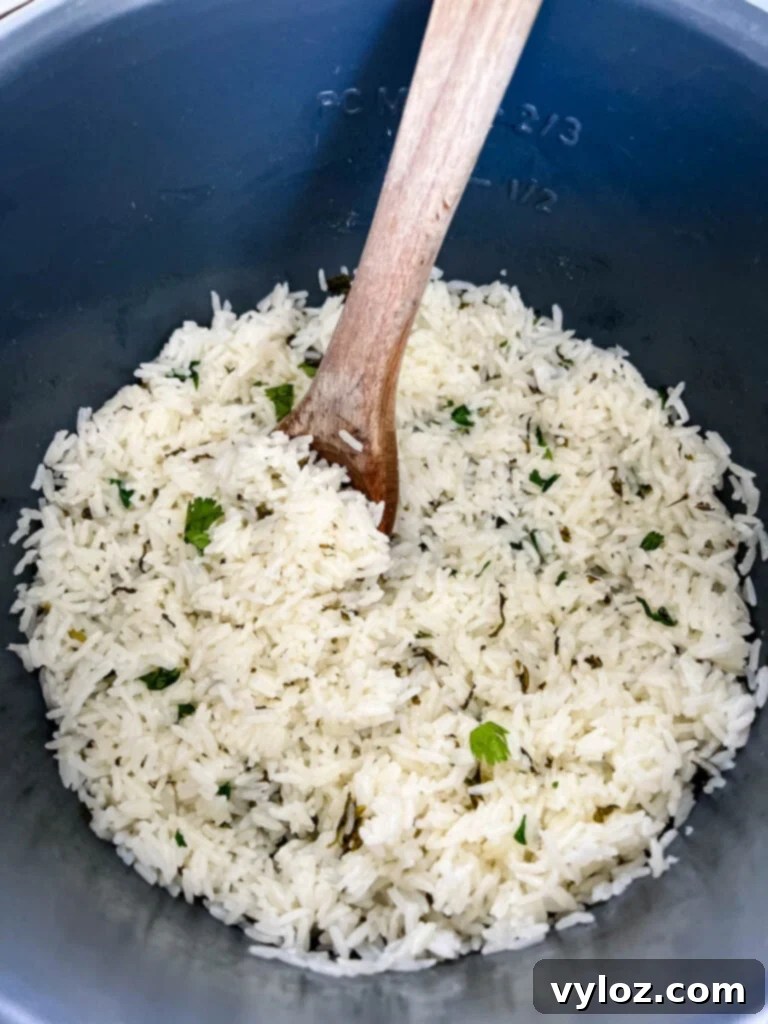 a wooden spoonful of Chipotle cilantro lime rice