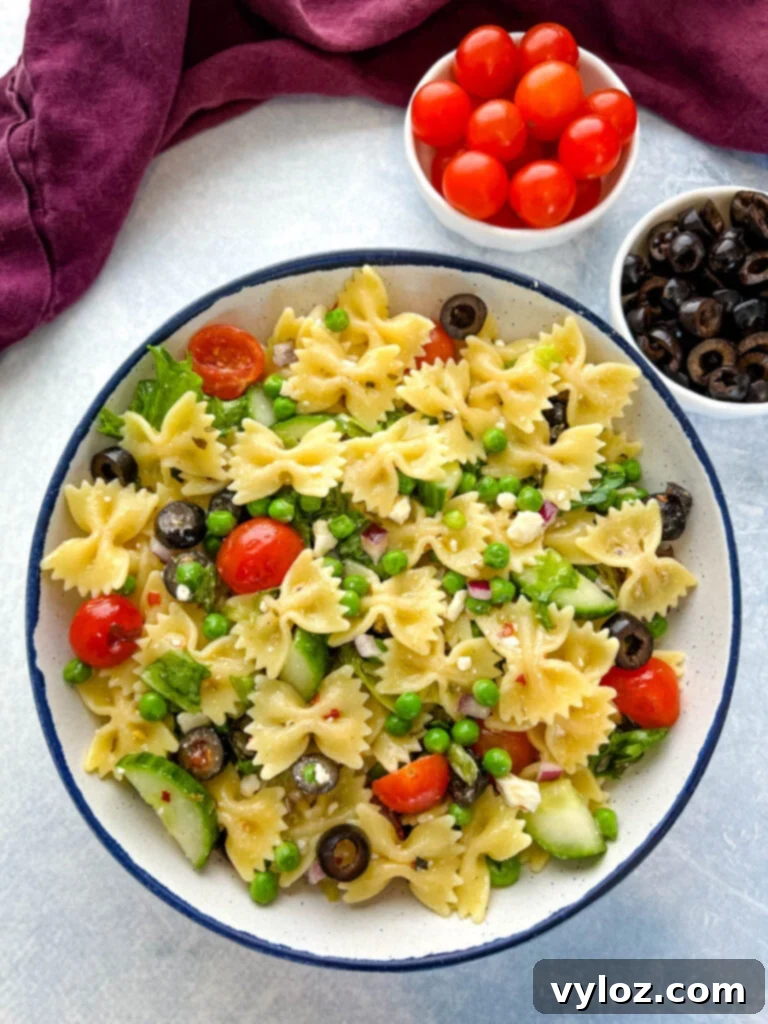 Zesty Bow Tie Pasta Salad 2 bow tie farfalle pasta salad with vegetables with Italian dressing in a bowl