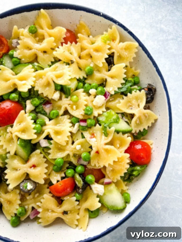 Zesty Bow Tie Pasta Salad 12 bow tie farfalle pasta salad with vegetables with Italian dressing in a bowl