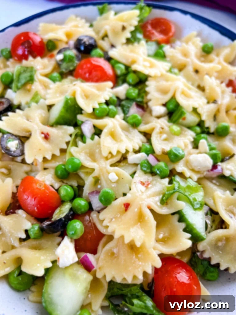 Zesty Bow Tie Pasta Salad 13 bow tie farfalle pasta salad with vegetables with Italian dressing in a bowl