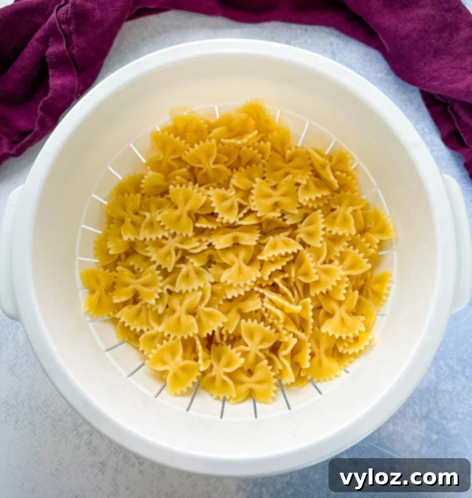 Zesty Bow Tie Pasta Salad 4 cooked farfalle bow tie pasta in a bowl