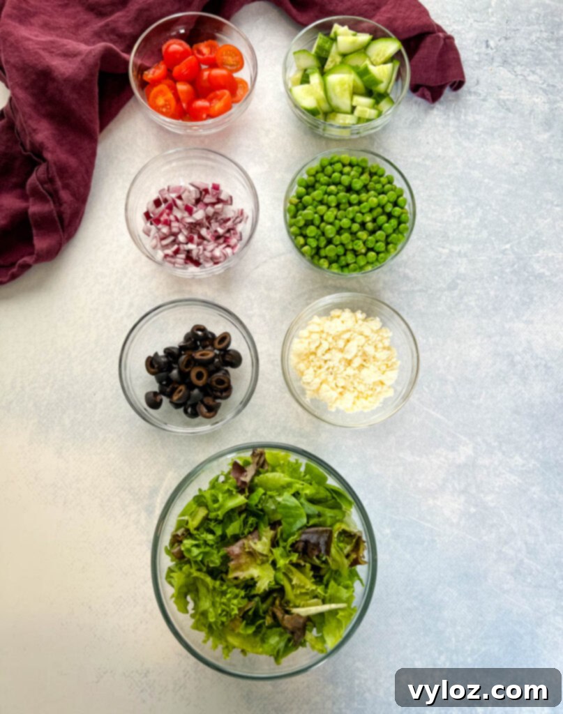 Zesty Bow Tie Pasta Salad 7 tomatoes, cucumbers, onions, peas, olives, feta, and fresh mixed greens in separate bowls