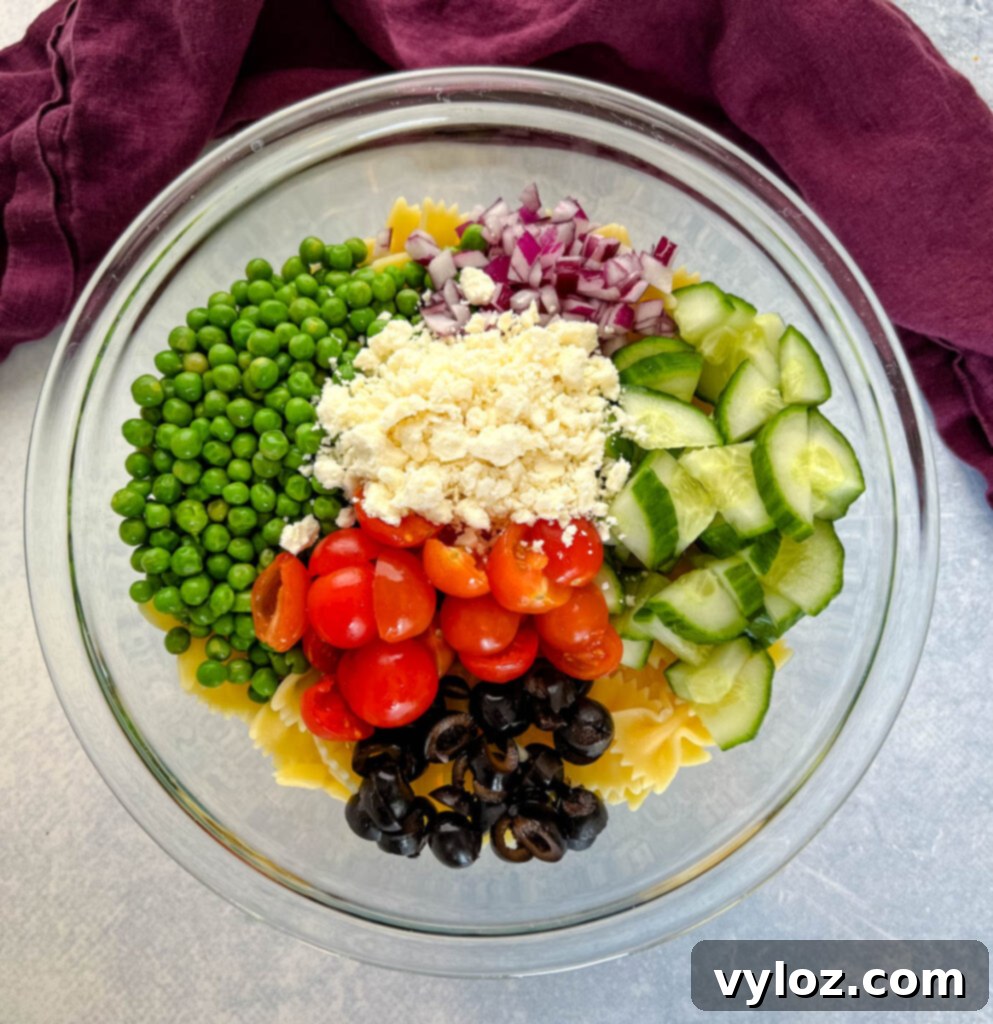 Zesty Bow Tie Pasta Salad 8 bow tie farfalle pasta salad with vegetables with Italian dressing in a glass bowl bowl