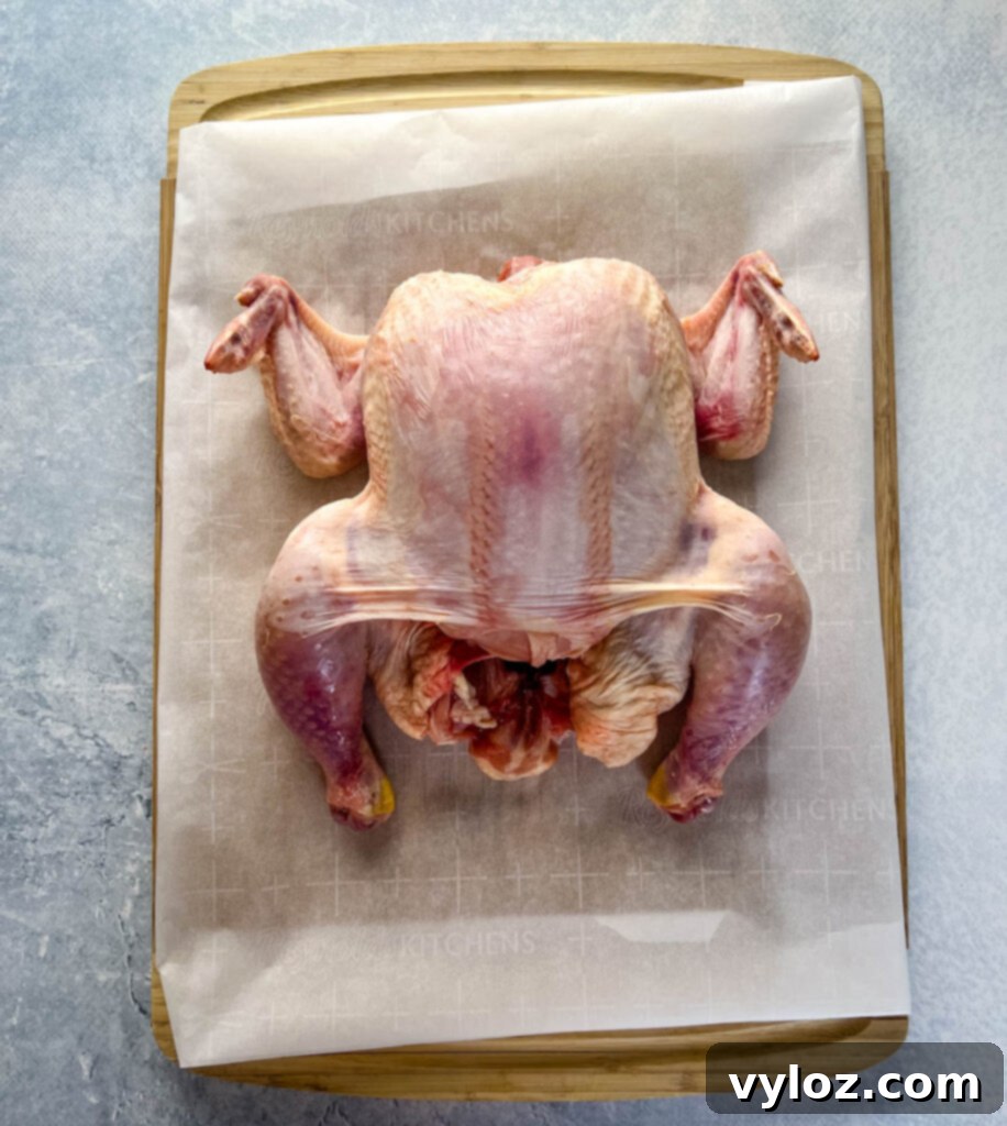 Ultimate Traeger Smoked Whole Chicken 3 raw whole chicken on a cutting board