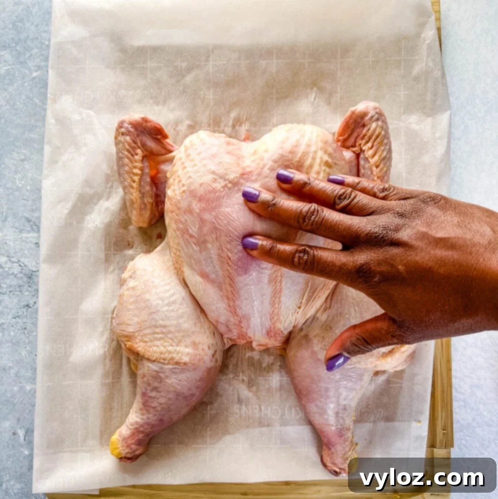 Ultimate Traeger Smoked Whole Chicken 6 raw whole chicken on a cutting board