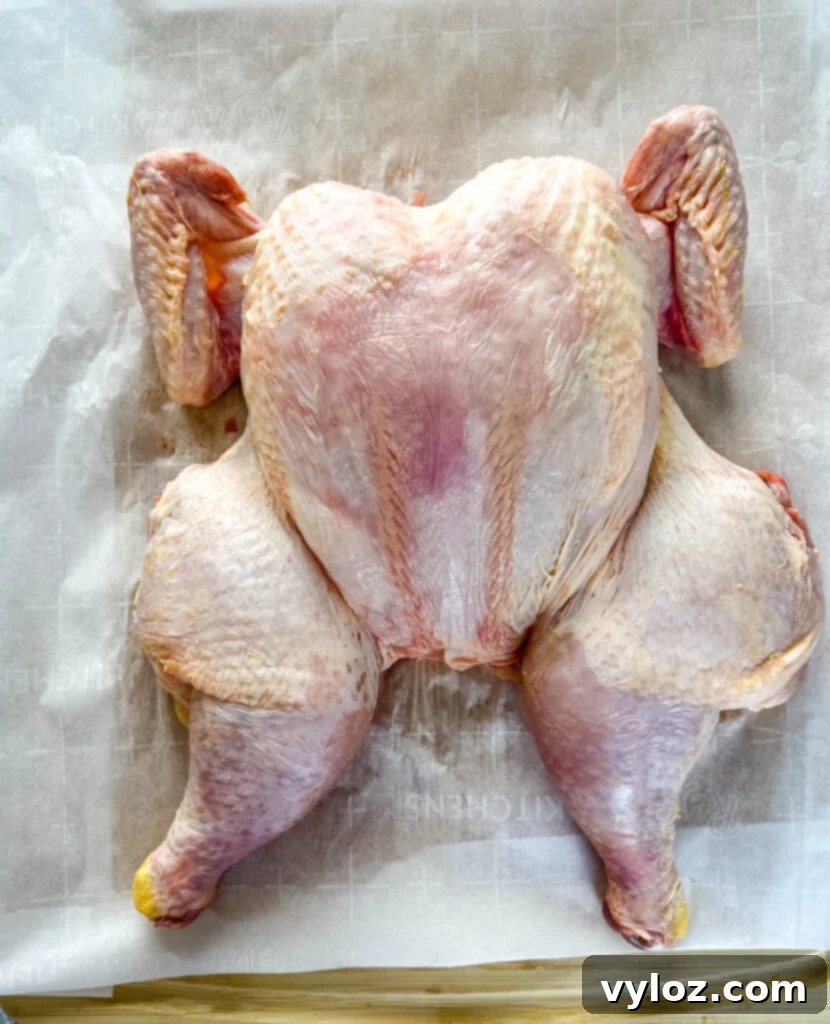 Ultimate Traeger Smoked Whole Chicken 7 raw whole chicken on a cutting board