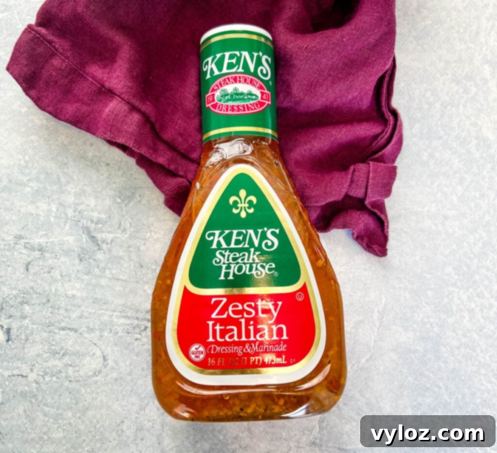 Your Go-To Hot Girl Summer Salad 5 A bottle of Zesty Italian dressing, a flavorful component that ties together all the ingredients of the Hot Girl Summer Salad.