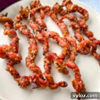 cooked twisted bacon on a plate