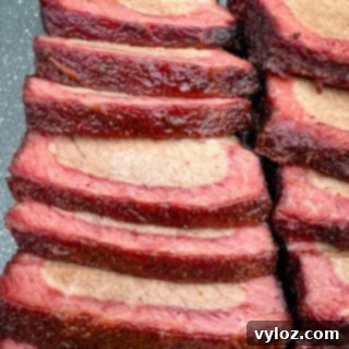 Traeger smoked brisket on a plate, ready to be served and enjoyed.