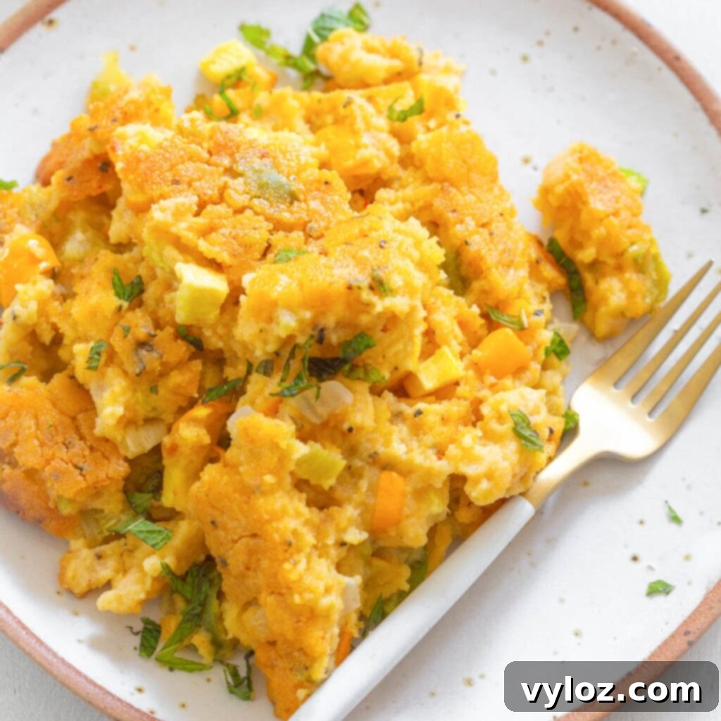 Southern Squash Dressing served on a plate with a fork, ready to be enjoyed during a holiday meal or Sunday dinner.