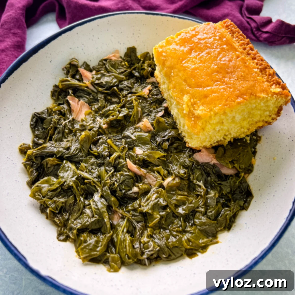 Southern turnip greens in a bowl with a slice of cornbread