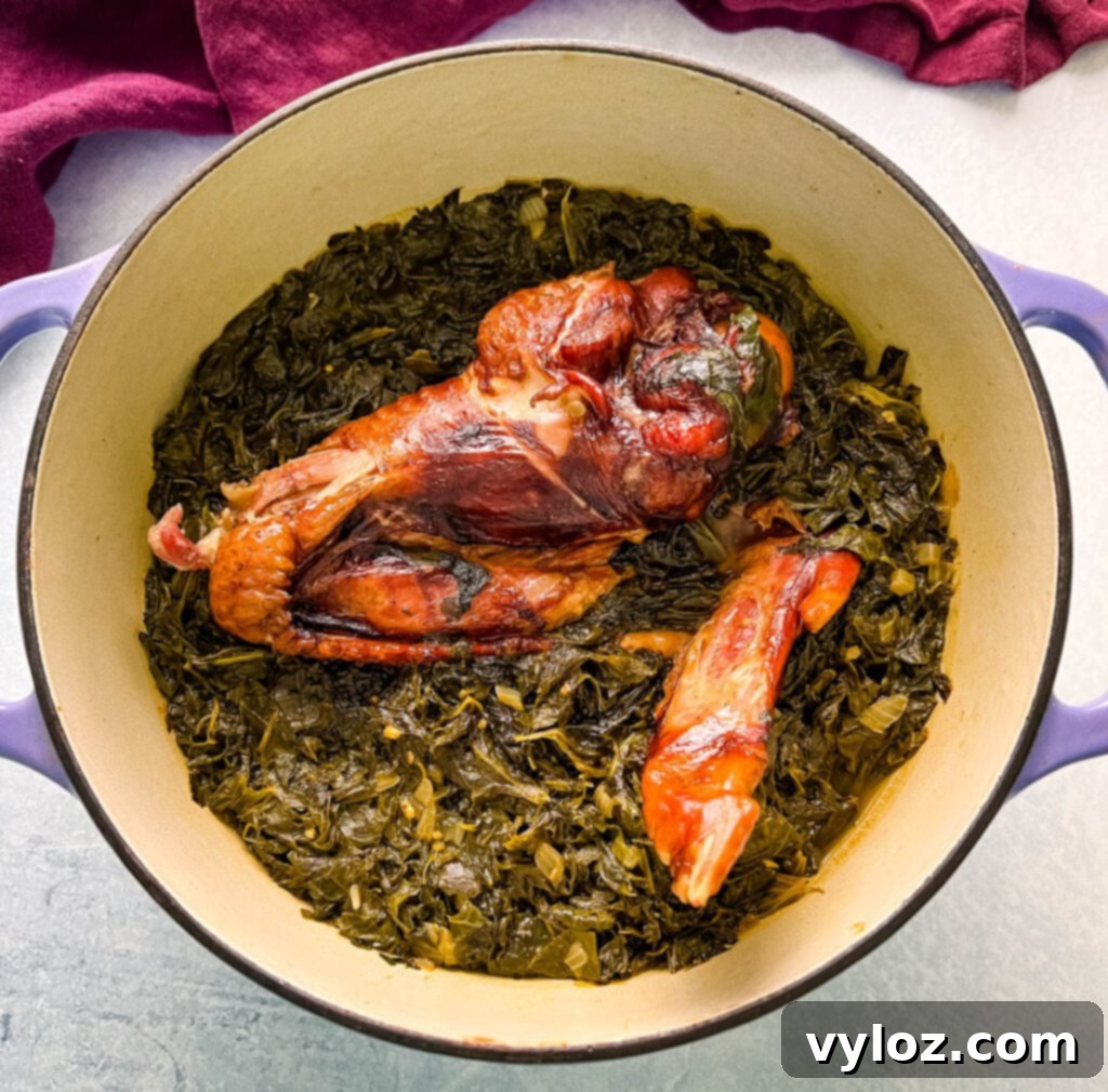 cooked turnip greens and smoked turkey in a Dutch oven