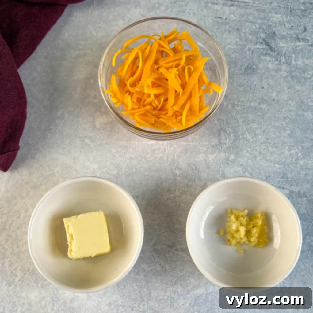 Perfectly Baked Stuffed Chicken 6 shredded cheese, butter, and garlic in separate bowls