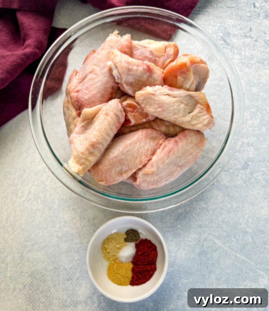 Fiery Honey Glazed Wings 3 raw chicken wings and spices in separate bowls