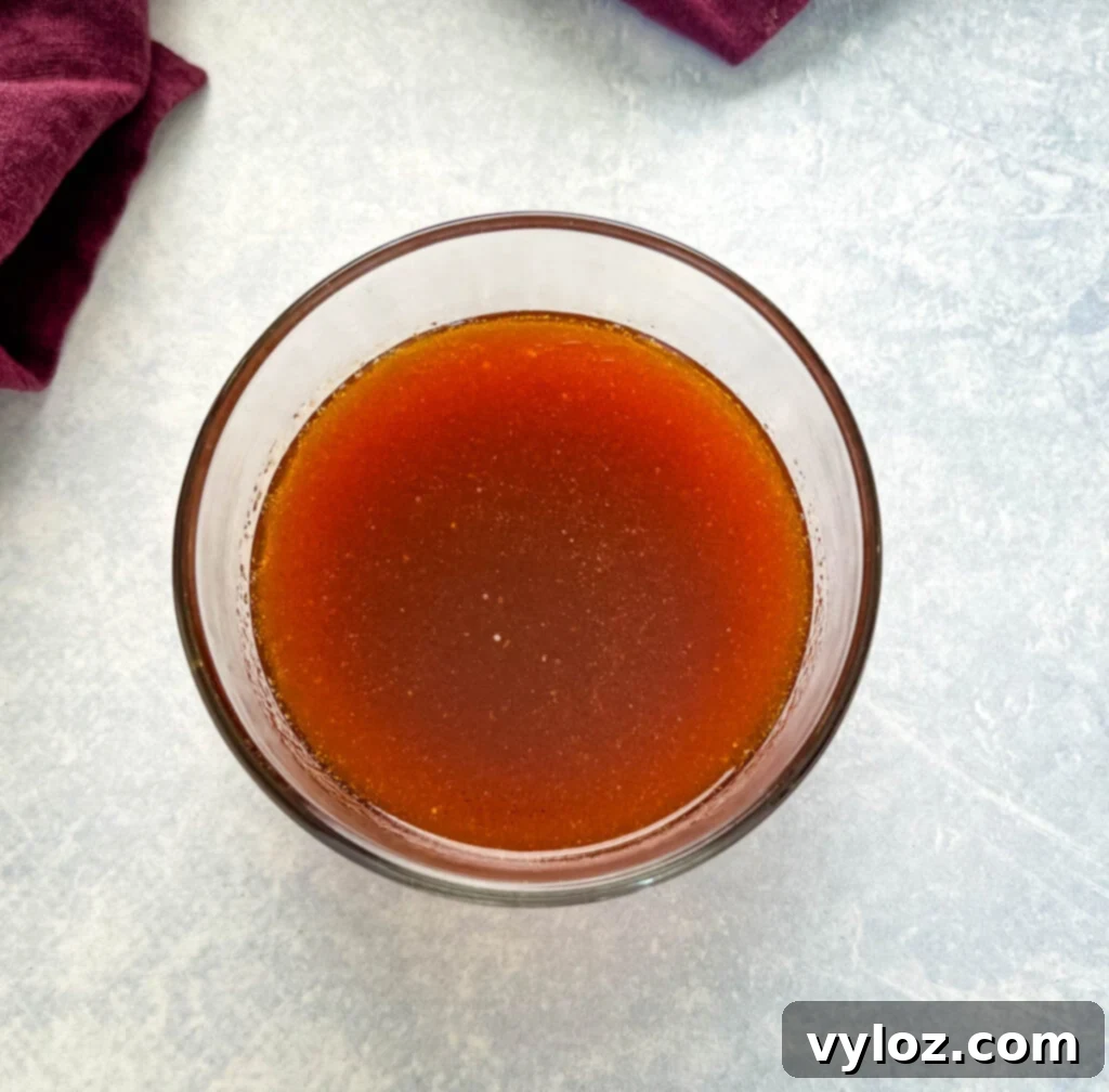 Fiery Honey Glazed Wings 5 honey hot sauce in a glass bowl