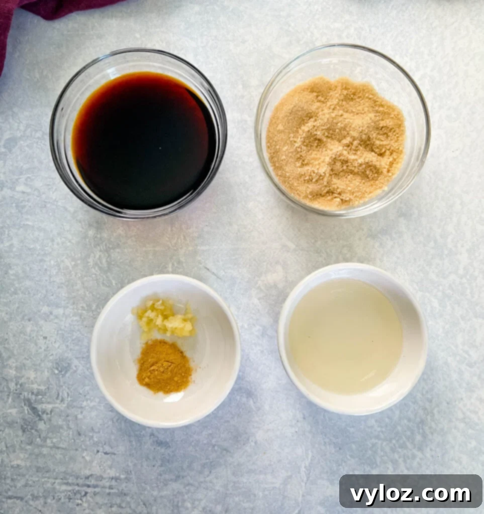 soy sauce, brown sugar, spices, and rice vinegar in separate white bowls