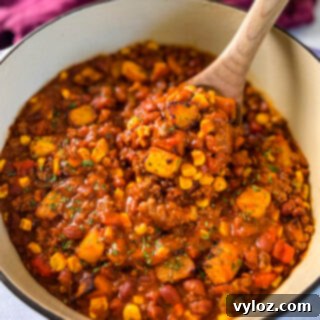 Hearty Butternut Squash Chili with Your Choice of Meat 13 A large wooden spoonful of butternut squash chili