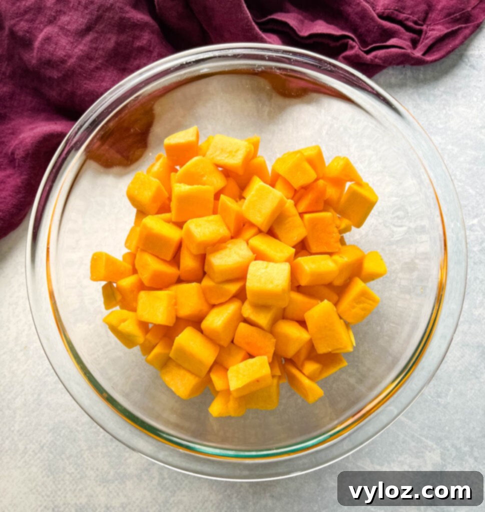 Hearty Butternut Squash Chili with Your Choice of Meat 3 Cubed butternut squash in a glass bowl, ready for cooking.