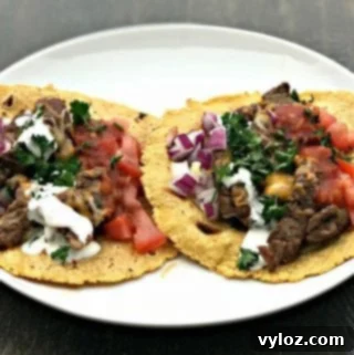 10-Minute Instant Pot Carne Asada Tacos 11 Instant Pot 10-Minute Steak Tacos (Carne Asada) on a white plate
