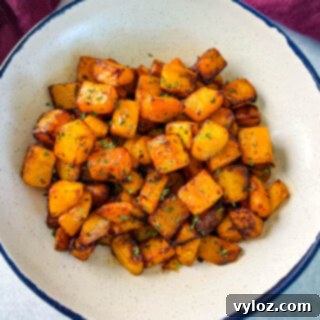 Delicious air-fried butternut squash in a white serving bowl