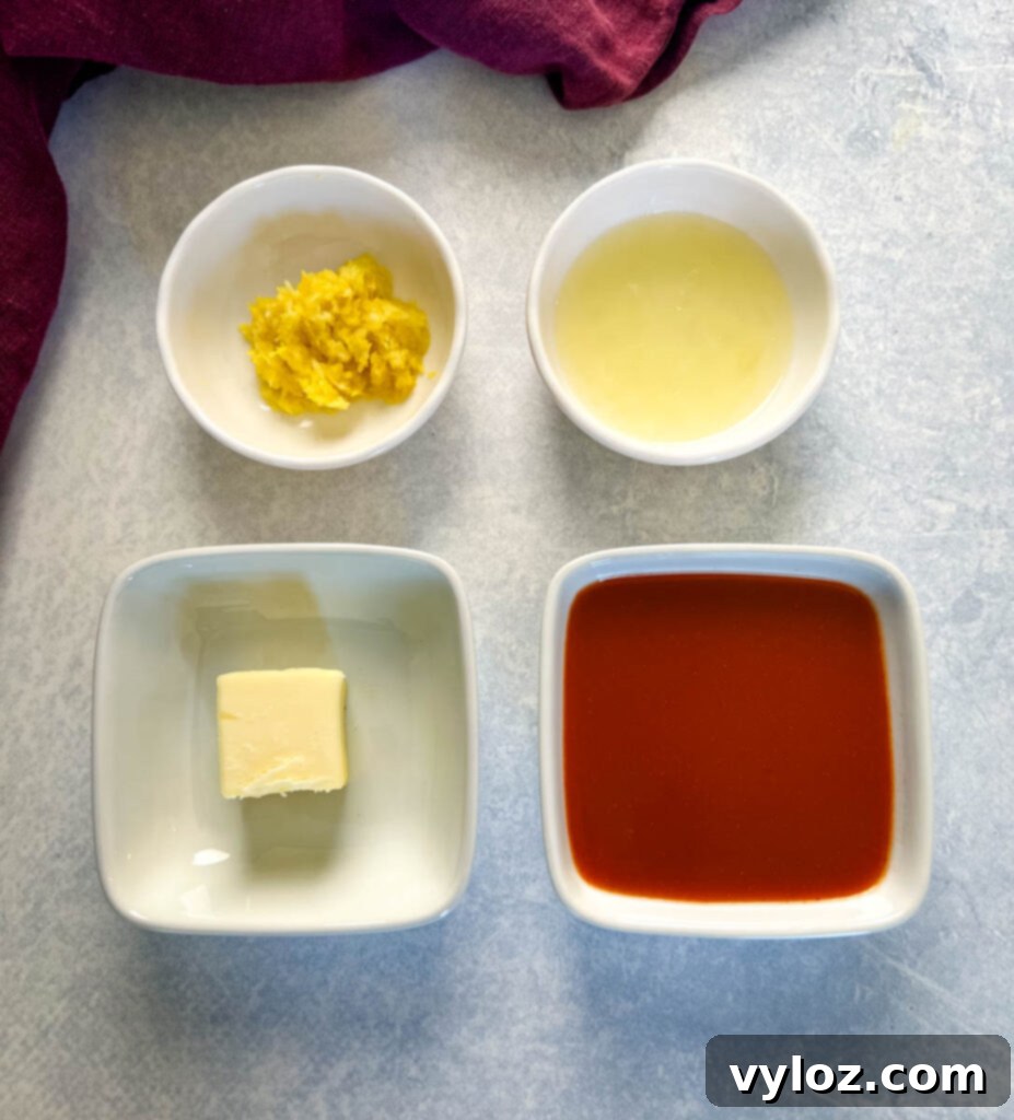 lemon zest, lemon juice, butter, and hot sauce in separate white bowls