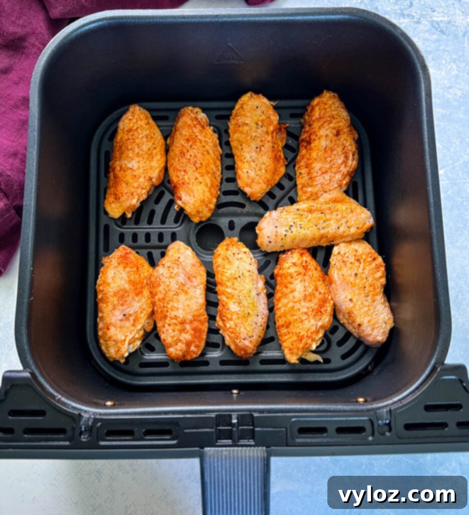 raw hot lemon pepper wings in an air fryer