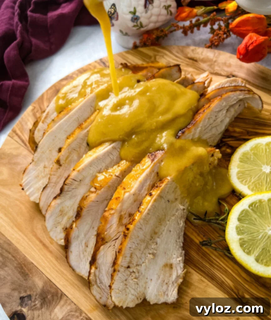 Golden brown turkey breast generously drizzled with rich, smooth gravy