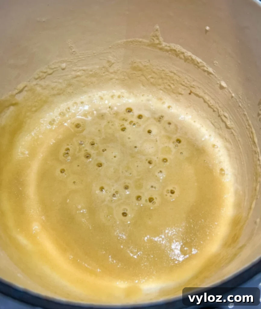 Golden brown roux in a saucepan, made from melted butter and flour