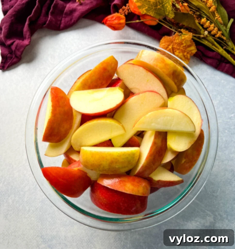 Caramel Apple Bliss 5 Gala and Honeycrisp apples, sliced into quarters, in a clear glass bowl