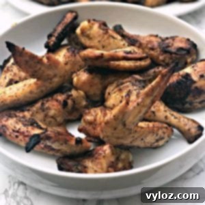 grilled bbq chicken wings in a large white bowl