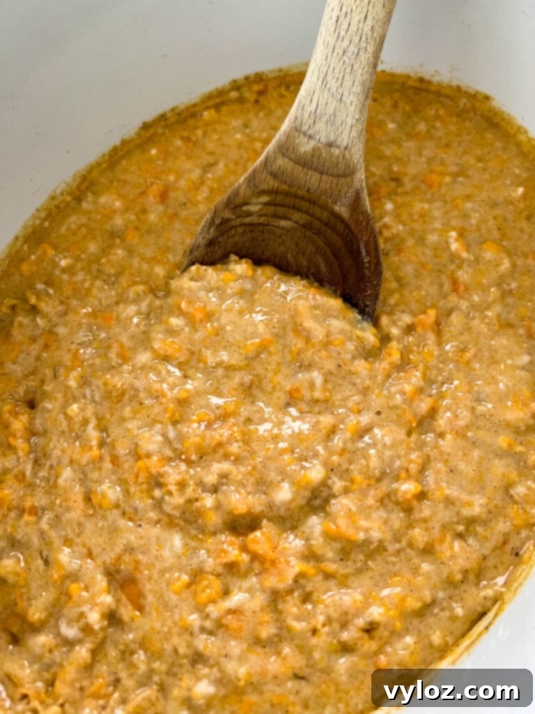 Sweet potato oatmeal cooking in a pot.