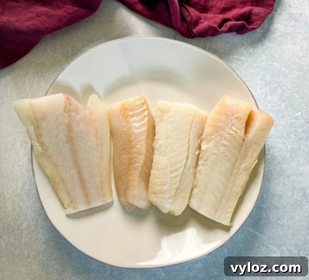 raw cod fillets on a plate