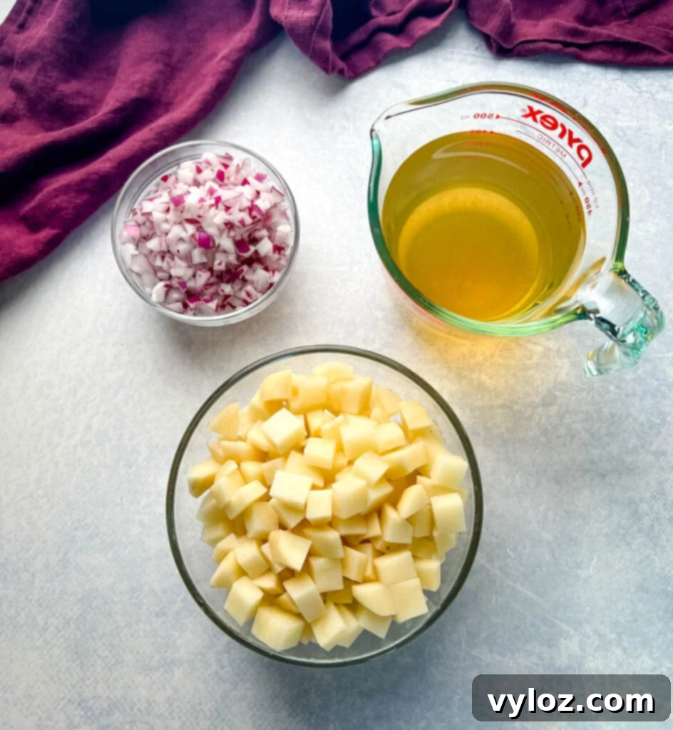 Hearty Slow Cooker Cheeseburger & Potato Soup 4 chopped onions, broth, and diced potatoes in a glass bowl