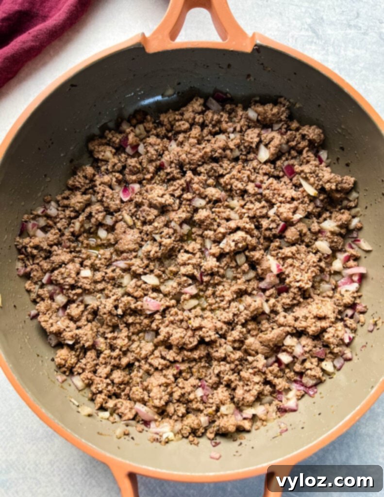 Hearty Slow Cooker Cheeseburger & Potato Soup 6 cooked ground beef in a skillet