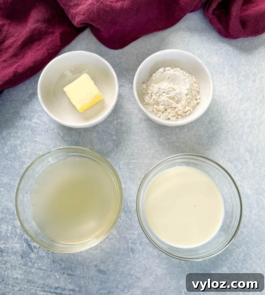 butter, flour, broth, and heavy cream in separate glass bowls