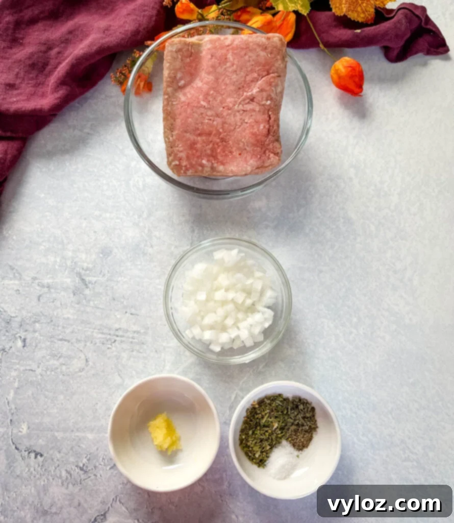 ground beef, white onions, garlic, and spices in separate bowls, ready for cooking