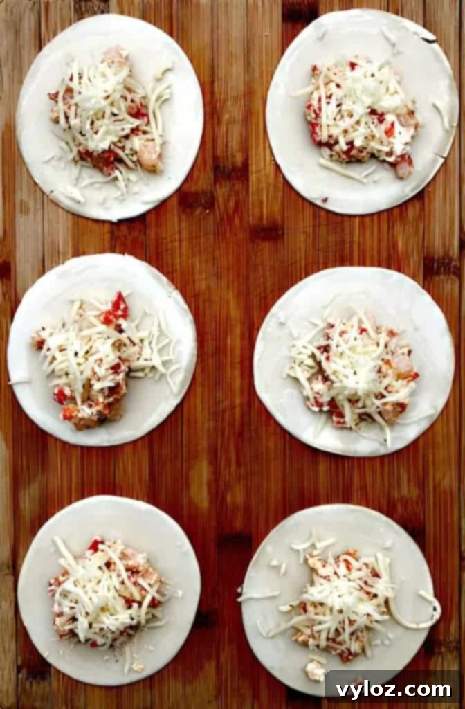 Savory Shrimp Red Pepper Cream Cheese Empanadas 3 Shrimp Red Pepper Cream Cheese Empanadas garnished with fresh lemon wedges