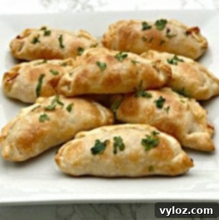 Savory Shrimp Red Pepper Cream Cheese Empanadas 10 Shrimp Red Pepper Cream Cheese Empanadas with a golden crust