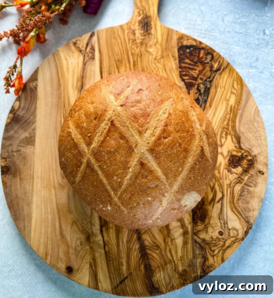 sourdough bread loaf on a wooden cutting board