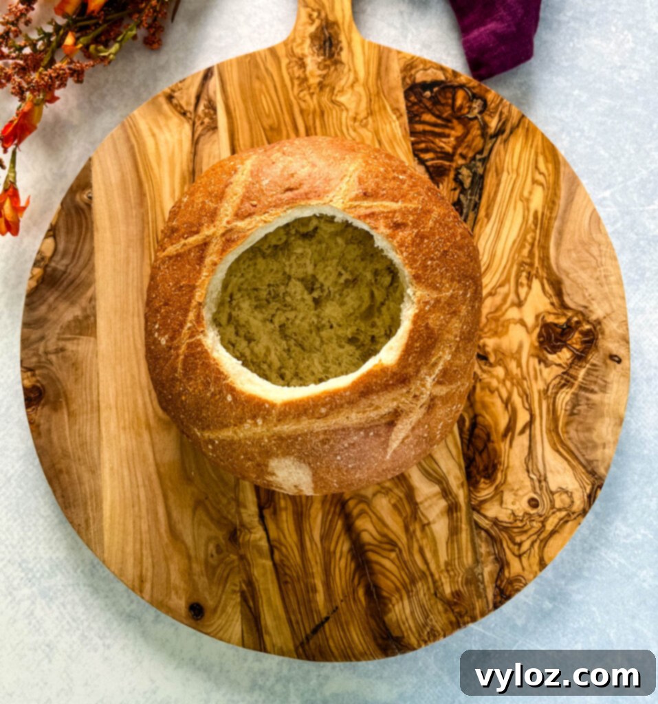 sourdough bread loaf on a wooden cutting board