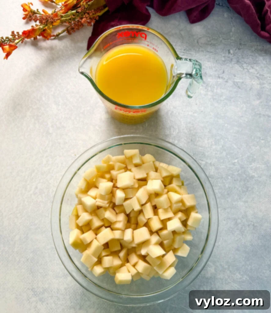 sliced potatoes and broth in separate glass bowls