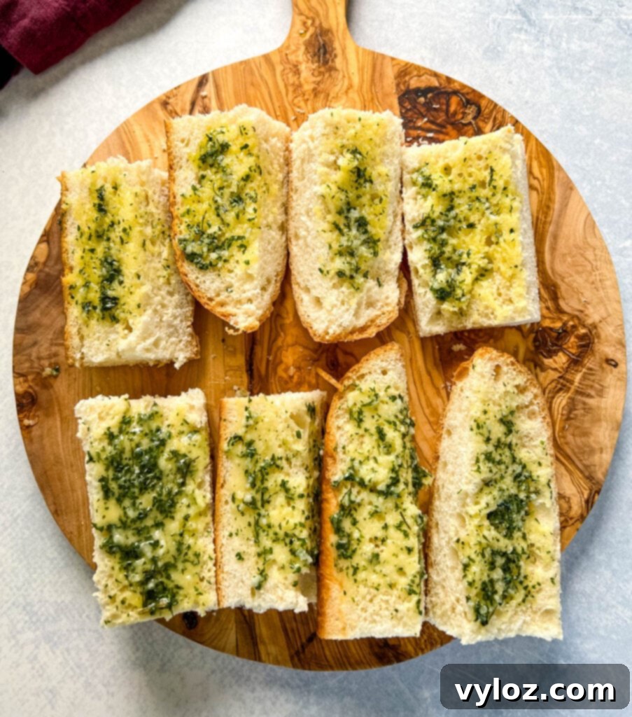 sliced garlic bread on a cutting board