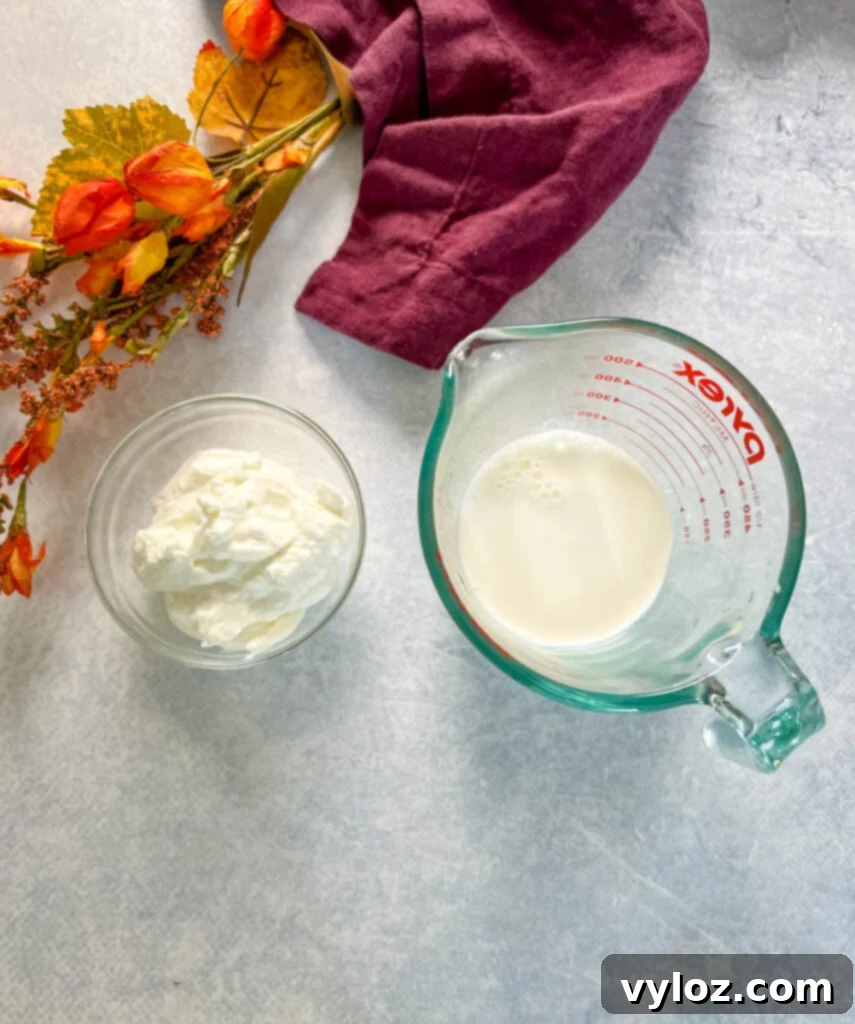 Ultimate Slow Cooker Loaded Potato and Bacon Soup 8 Separate glass bowls containing creamy sour cream and rich cream cheese, key ingredients for thickening the soup.