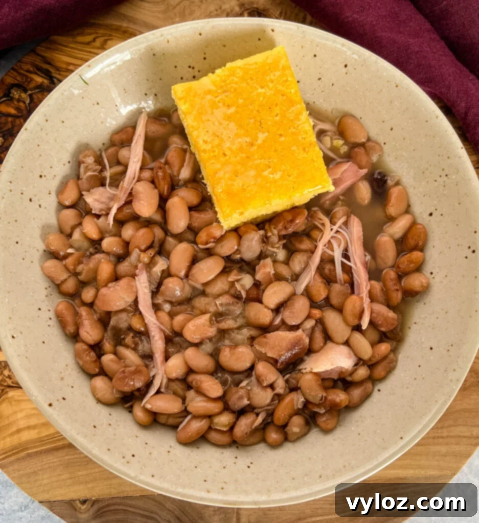 slow cooker Crockpot pinto beans and cornbread in a bowl