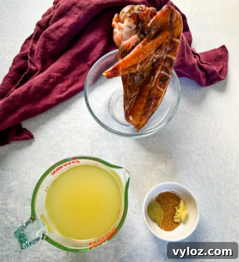 smoked turkey, broth, and spices in separate bowls