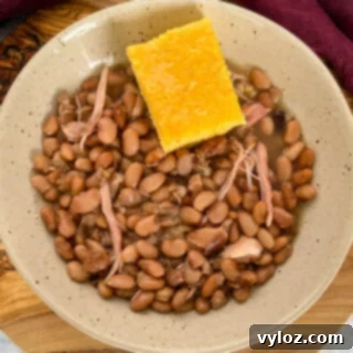 slow cooker Crockpot pinto beans and cornbread in a bowl