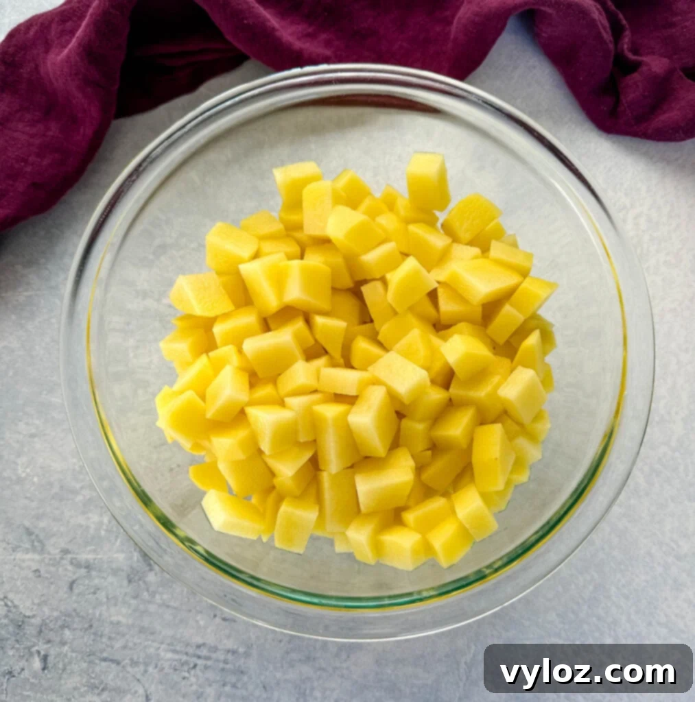 Velvety Buttermilk Mash 4 diced gold potatoes in a glass bowl