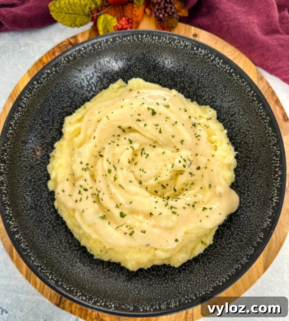 Velvety Buttermilk Mash 9 Southern buttermilk mashed potatoes in a black bowl