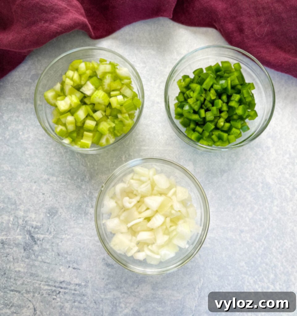 Cajun Ground Beef and Rice 7 Finely chopped celery, green bell peppers, and white onions in separate bowls – the Holy Trinity.