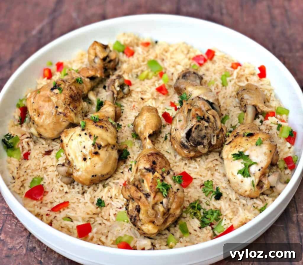 Instant Pot Arroz con Pollo Drumsticks 2 A beautifully presented bowl of Arroz con Pollo featuring tender chicken drumsticks and fragrant Spanish rice, ready to be enjoyed.